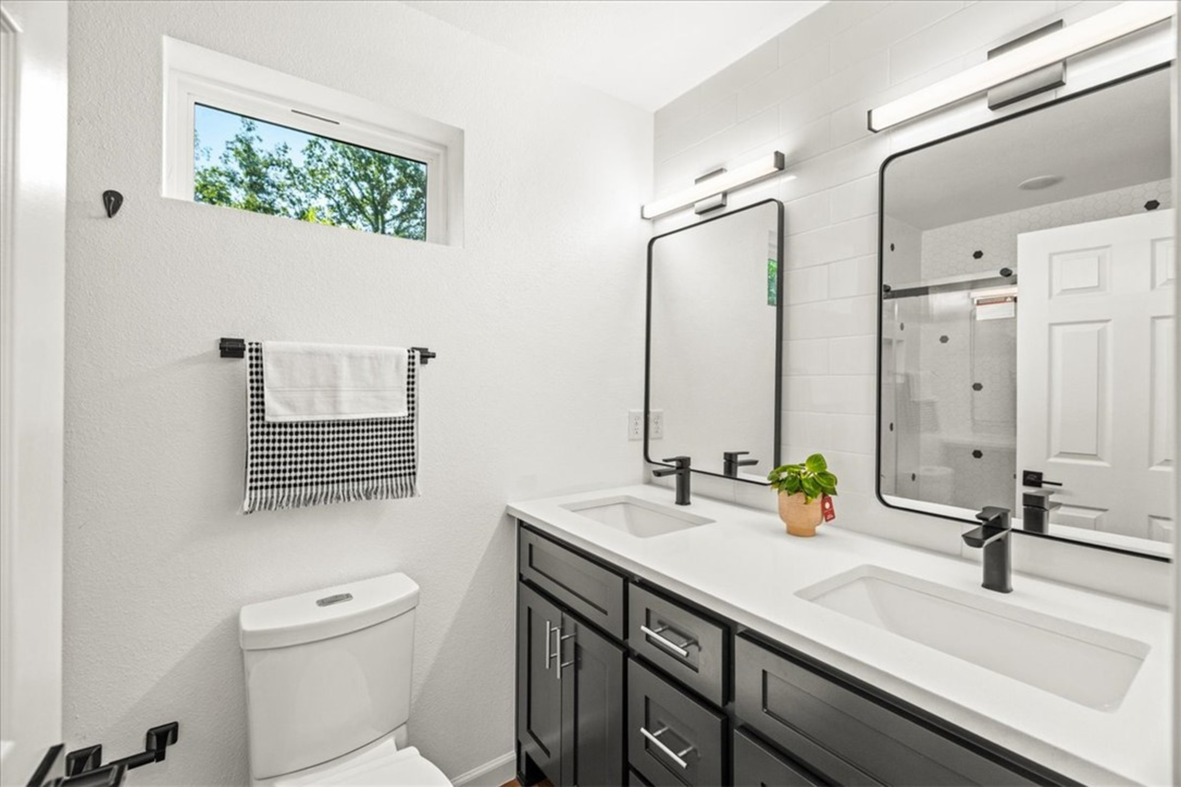 Bath vanity, toilet, and transom light